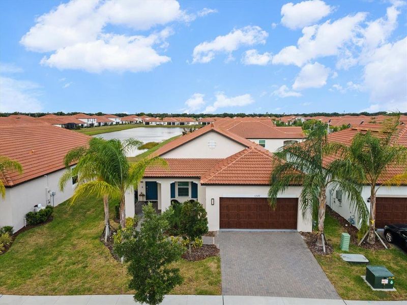 Front exterior of a new home in Southshore Bay Active Adult, Wimauma, FL, highlighting curb appeal (Image 23).