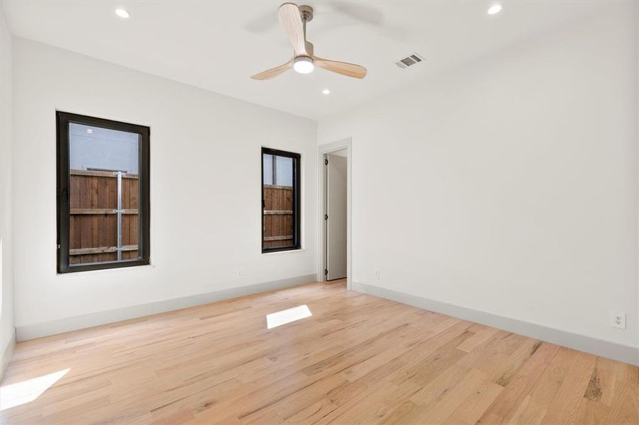 Spare room featuring ceiling fan and light hardwood / wood-style flooring