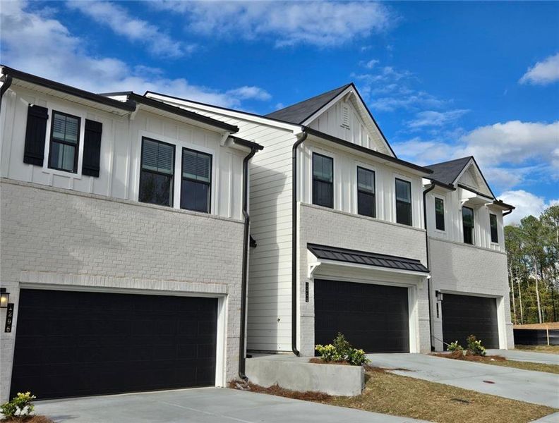 Front exterior of a new home in , Lawrenceville, GA, highlighting curb appeal (Image 26).