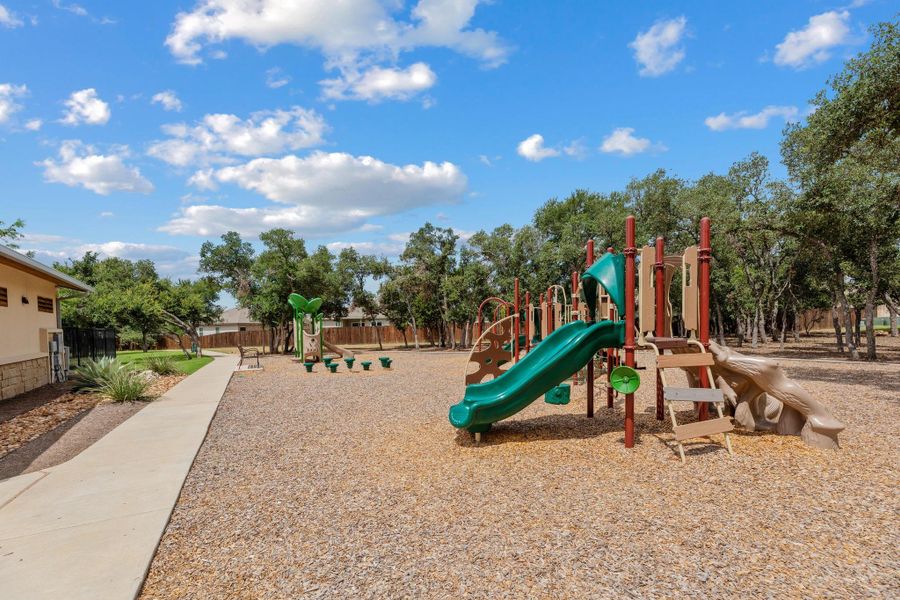 A vibrant playground set amidst mature trees offers a delightful outdoor space for recreation. A vibrant playground set amidst mature trees offers a delightful outdoor space for recreation.