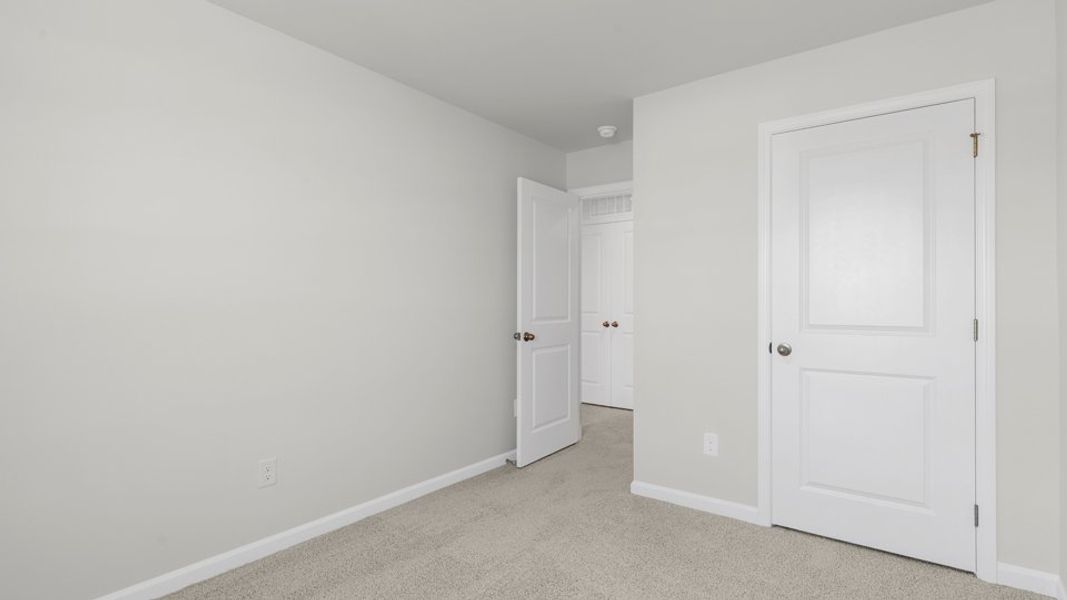 Spacious, unfurnished interior of a new home in The Townes at Belle Grove, Wendell (Image 27).