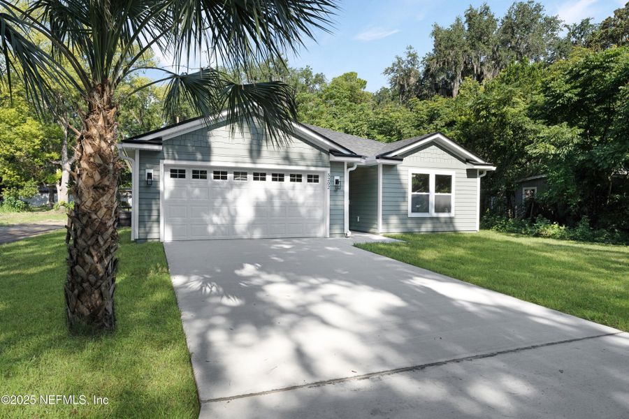 Front exterior of a new home in , Jacksonville, FL, highlighting curb appeal (Image 2).