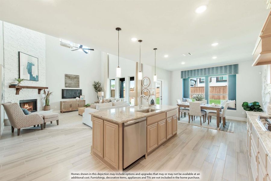 Open-concept kitchen with island and granite countertops, flowing into living and dining areas with high ceilings and fireplace Open-concept kitchen with island and granite countertops, flowing into living and dining areas with high ceilings and fireplace
