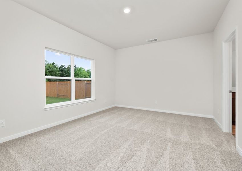 The master bedroom is spacious with a large window. The master bedroom is spacious with a large window.