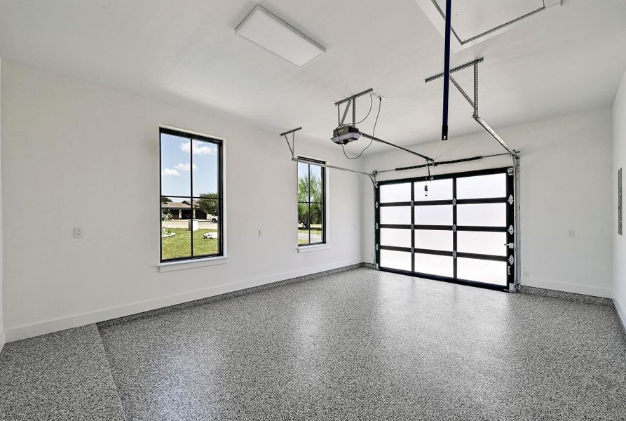 1 car garage. Both garage have apoxy floors and EV chargers. 1 car garage. Both garage have apoxy floors and EV chargers.