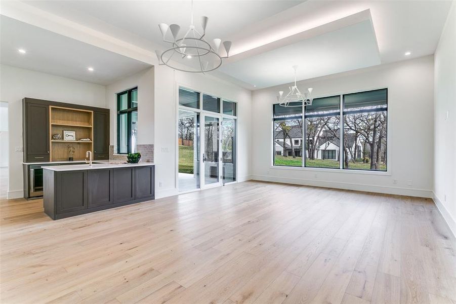 Another view of spacious game room and bar. This room offers multiple seating options, room for a billiard table and views into the fabulous backyard. Another view of spacious game room and bar. This room offers multiple seating options, room for a billiard table and views into the fabulous backyard.