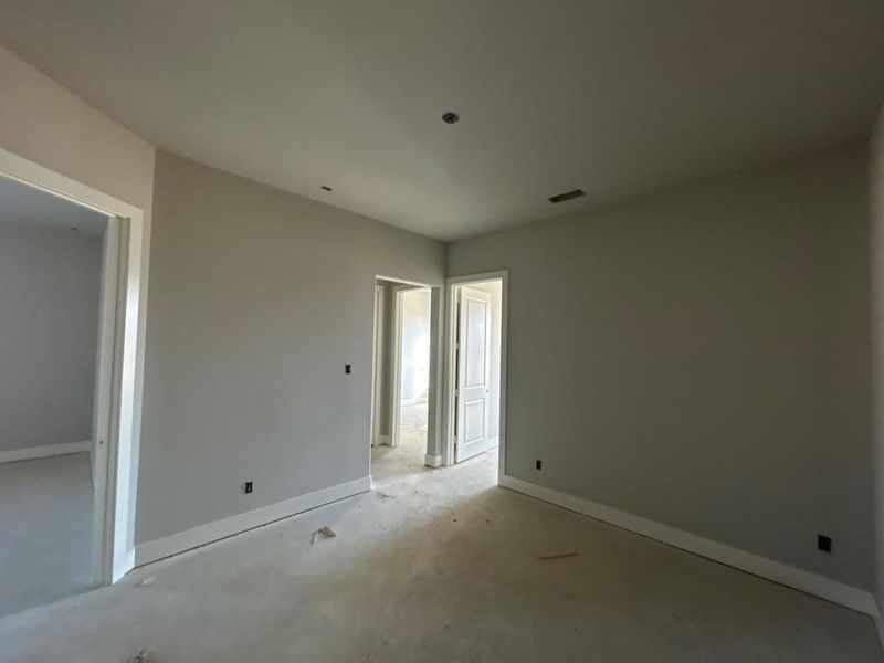 Unfurnished room with baseboards