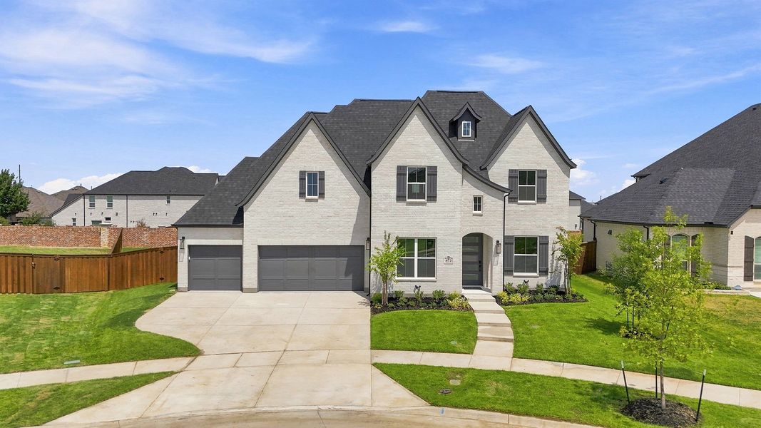 Front exterior of a new home in Estates at Rockhill, Frisco, TX, highlighting curb appeal (Image 2). Front exterior of a new home in Estates at Rockhill, Frisco, TX, highlighting curb appeal (Image 2).