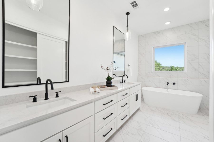 Elegant finishes and generous space define every bathroom in this home. Elegant finishes and generous space define every bathroom in this home.