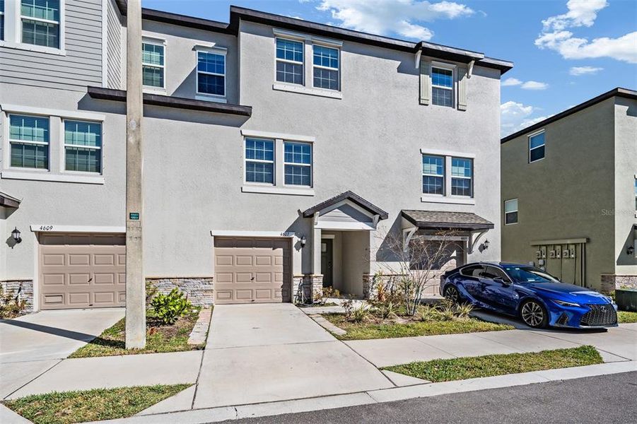 Front exterior of a new home in , Tampa, FL, highlighting curb appeal (Image 30).