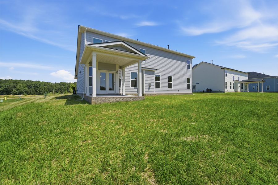 Exterior details and patio area of a home in Aden Woods, Fairview (Image 24).