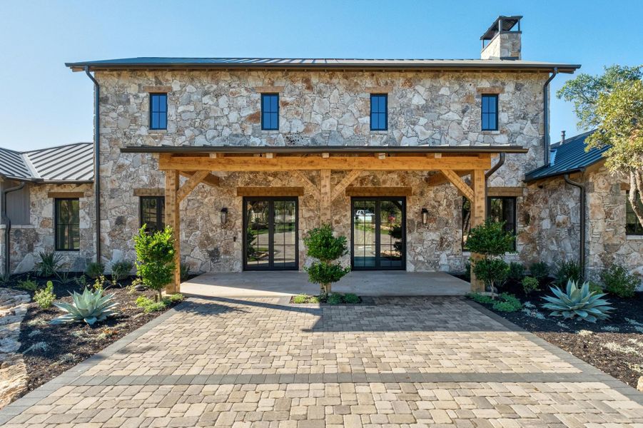 Front exterior of a new home in , Dripping Springs, TX, highlighting curb appeal (Image 29).