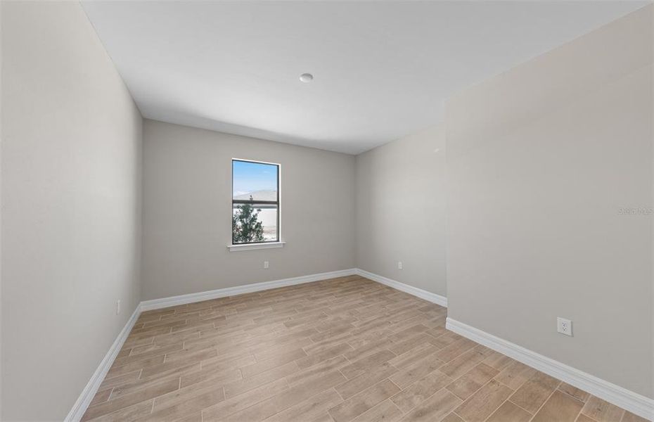 Spacious, unfurnished interior of a new home in The Strand at Cedar Grove, North Port (Image 20).