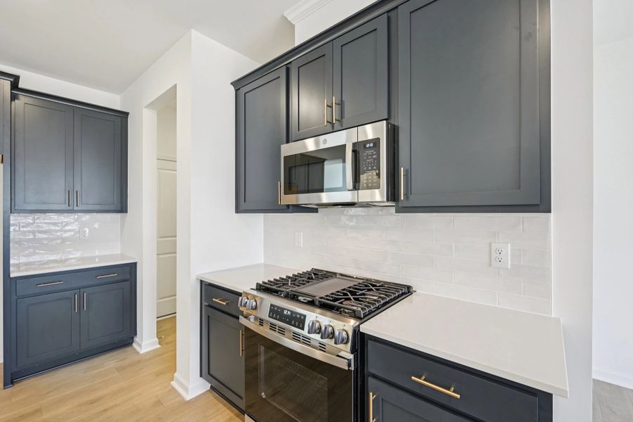 Kitchen featuring the AW Collection® Sapphire - Vibrant blues and crisp whites steal the show.