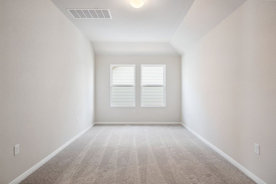 Representative unfurnished interior of a home built from the Blake by Ashton Woods in Rolling Glen, Hutto (Image 24).