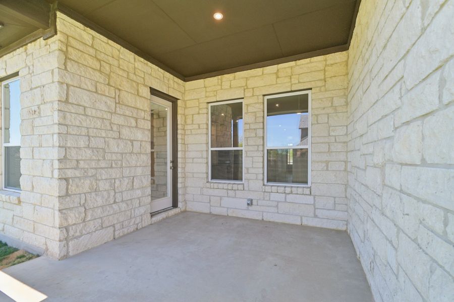 Exterior details and patio area of a home in Persimmon, Buda (Image 13).