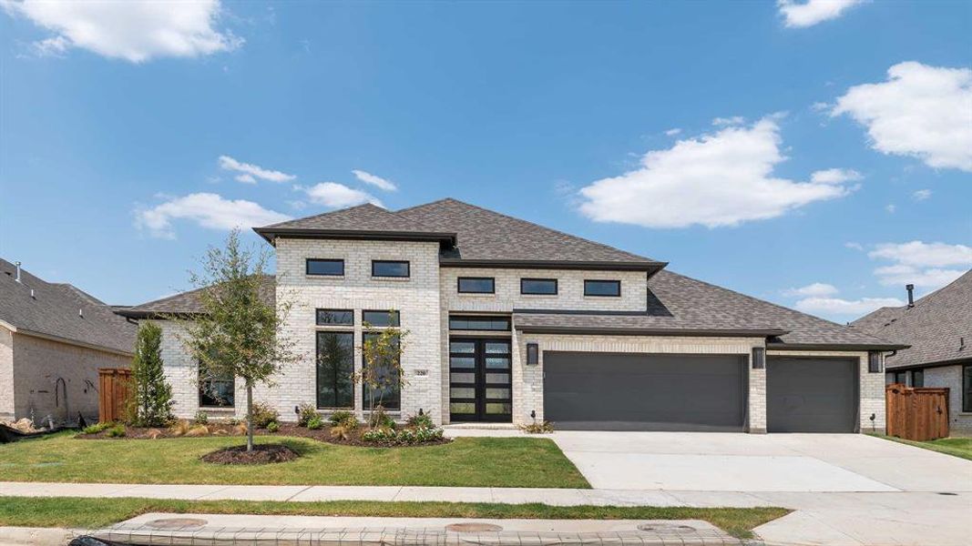 Prairie-style home with a front yard