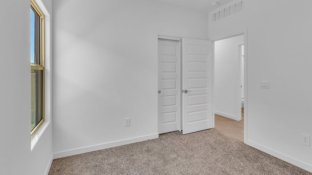 Representative unfurnished interior of a home built from the Parker by D.R. Horton in The Oasis at Rocking K, Vail (Image 36).