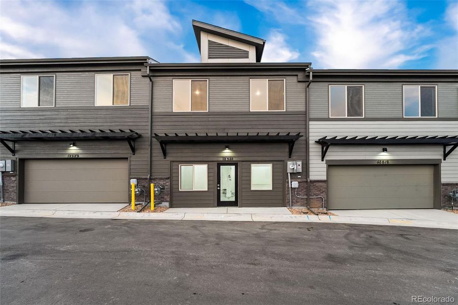 Front exterior of a new home in , Arvada, CO, highlighting curb appeal (Image 23).