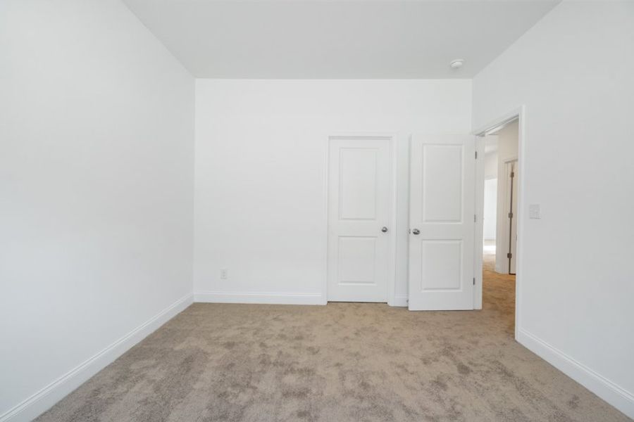 Representative unfurnished interior of a home built from the Ingram by Taylor Morrison in Falls Creek, Flowery Branch (Image 46).