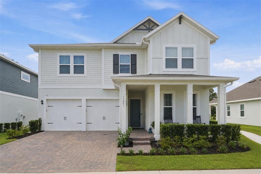 Front exterior of a new home in , Winter Garden, FL, highlighting curb appeal (Image 2). Front exterior of a new home in , Winter Garden, FL, highlighting curb appeal (Image 2).