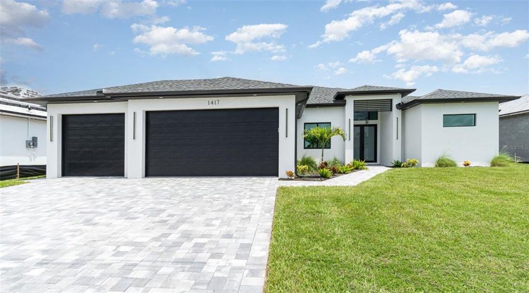 Front exterior of a new home in , Cape Coral, FL, highlighting curb appeal (Image 26).