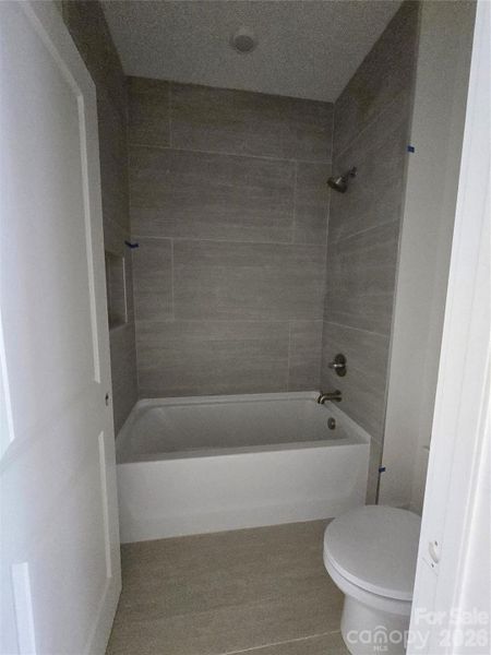 The tub and toilet area separated from the vanity for added privacy. The tub and toilet area separated from the vanity for added privacy.