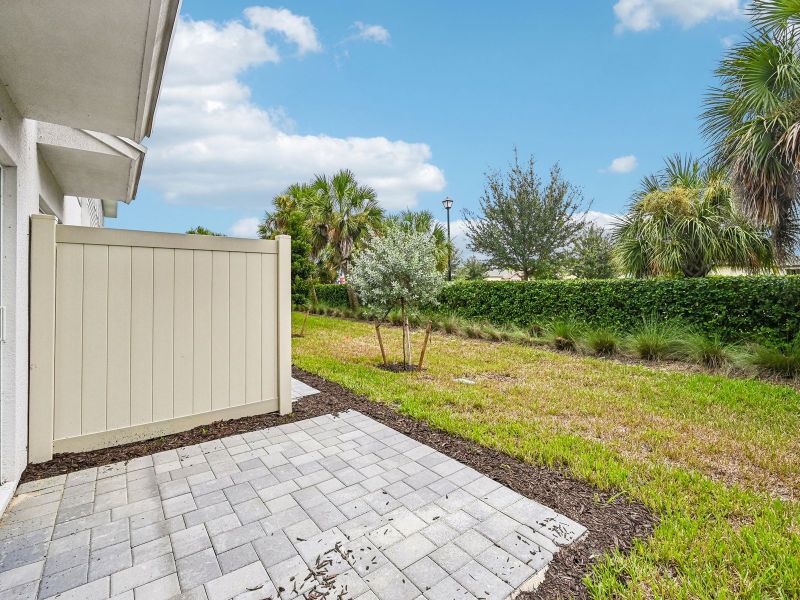 Exterior details and patio area of a home in Meritage Homes at Central Park, Port St. Lucie (Image 3).