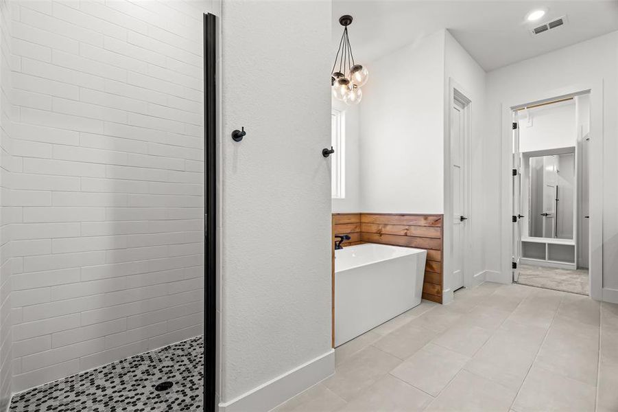 Bathroom featuring tile patterned floors and independent shower and bath