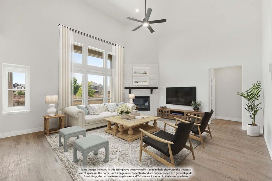 Living room with vaulted ceiling, stone fireplace, hardwood floors, and large windows Living room with vaulted ceiling, stone fireplace, hardwood floors, and large windows