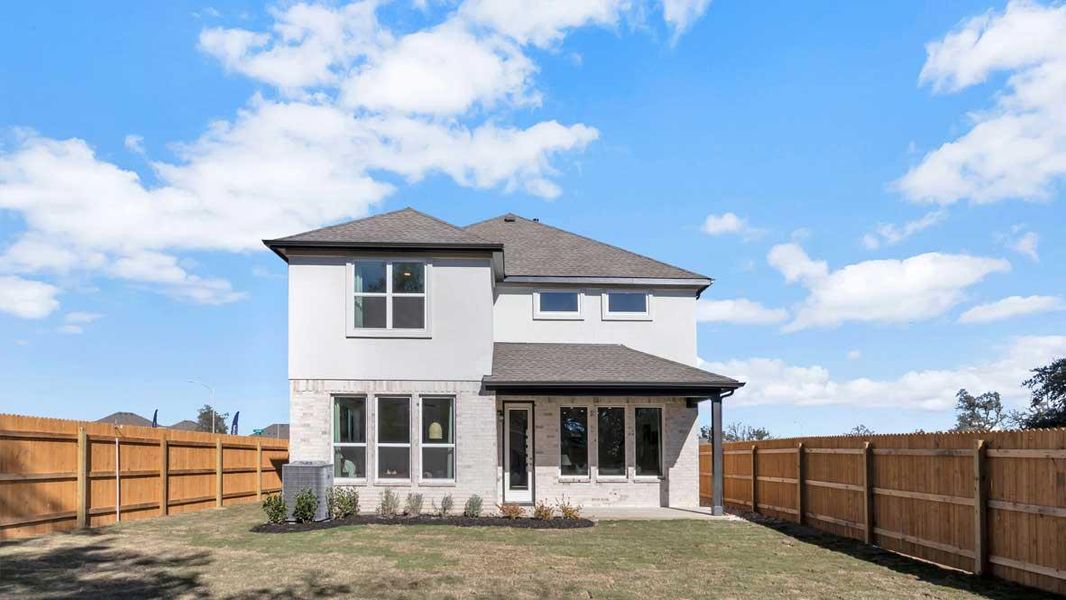 Front exterior of a new home in Rosenbusch Ranch, Leander, TX, highlighting curb appeal (Image 1).