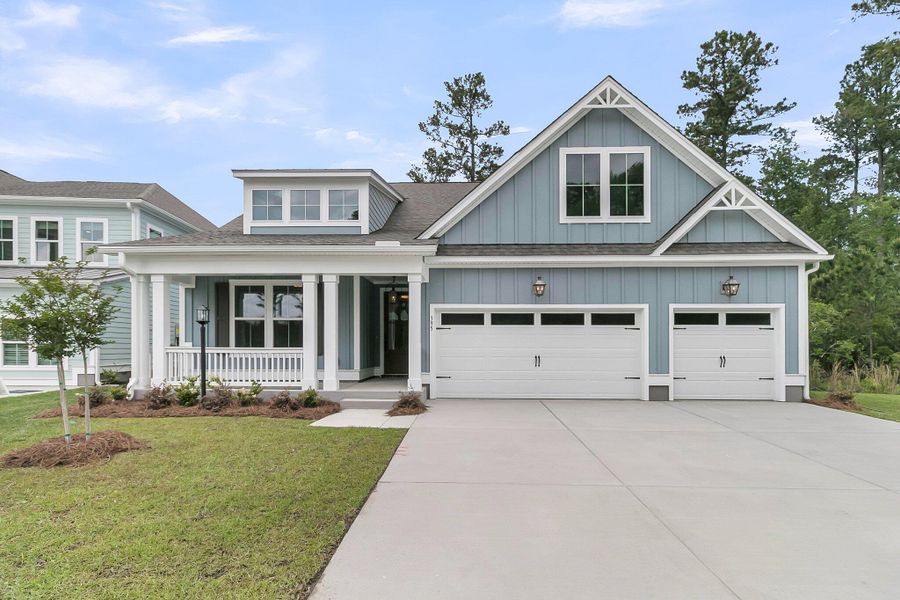 Front exterior of a new home in Tidewater at Lakes of Cane Bay, Summerville, SC, highlighting curb appeal (Image 1). Front exterior of a new home in Tidewater at Lakes of Cane Bay, Summerville, SC, highlighting curb appeal (Image 1).