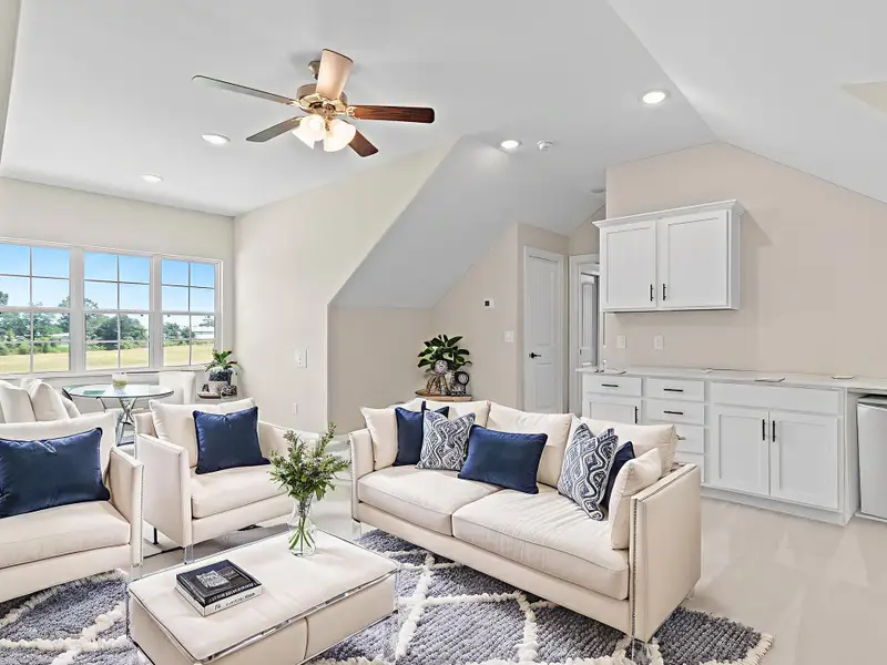 The Portico C’s flexible multi-use area adapts to your needs—ideal for a home office, hobby space, or casual gathering spot. Image depicts home as-is virtually staged.