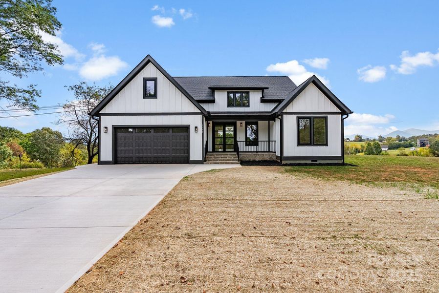 Front exterior of a new home in , Leicester, NC, highlighting curb appeal (Image 26).