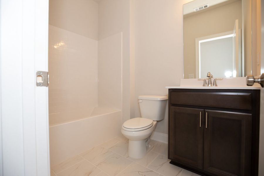 Representative furnished interior of a home built from the The Owens by The Providence Group in Waterhaven, Cumming (Image 18).