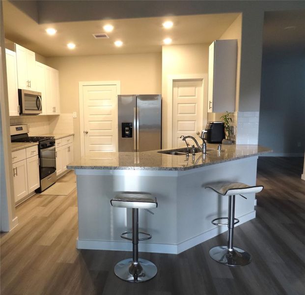 Furnished interior view inside a new home in Sierra Vista, Iowa Colony (Image 6).