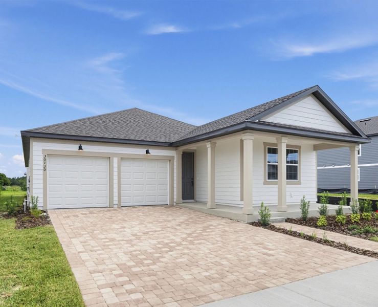 Front exterior of a new home in Trailside, Mount Dora, FL, highlighting curb appeal (Image 2). Front exterior of a new home in Trailside, Mount Dora, FL, highlighting curb appeal (Image 2).