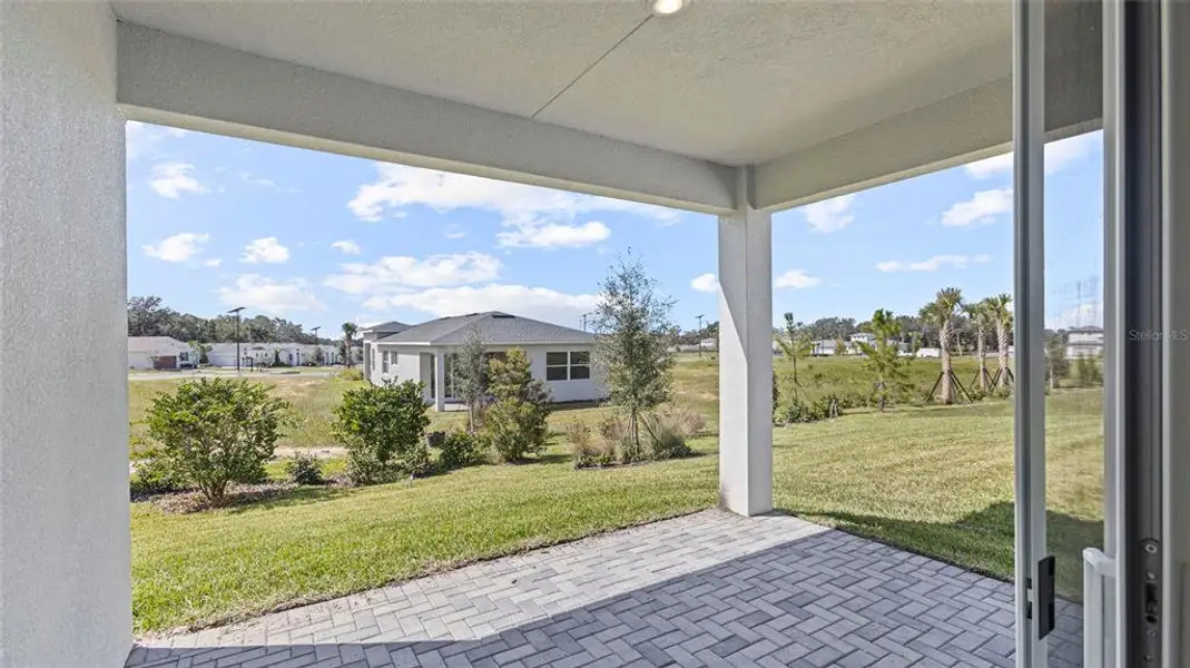 Exterior details and patio area of a home in Cresswind at Hammock Oaks, Lady Lake (Image 3).