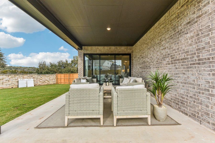 Covered patio with recessed lighting, brick exterior, and direct access to the interior Covered patio with recessed lighting, brick exterior, and direct access to the interior