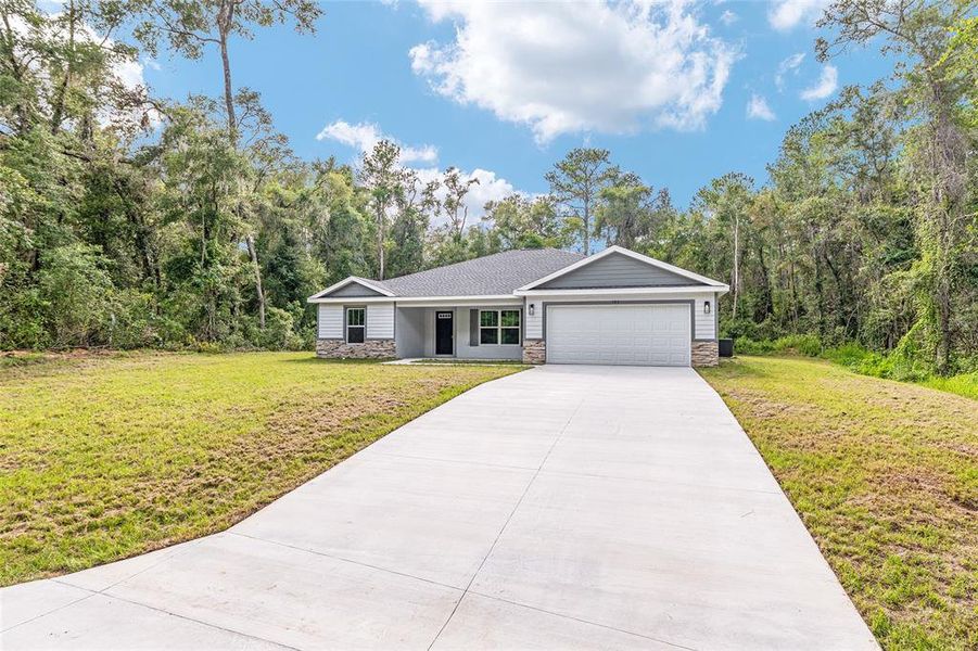 Front exterior of a new home in , Dunnellon, FL, highlighting curb appeal (Image 21).