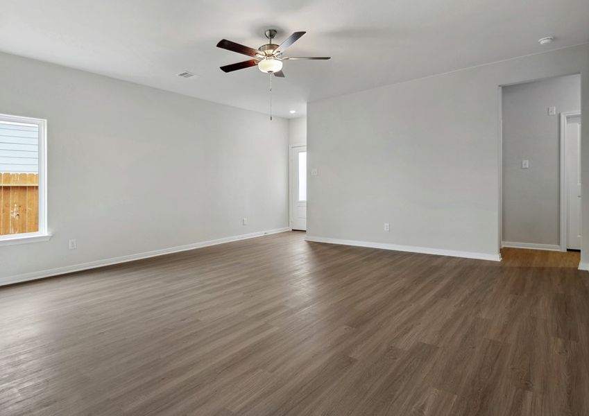 Family room with two windows and a 3/4 lite front door Family room with two windows and a 3/4 lite front door