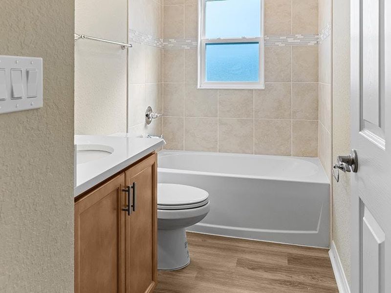 Secondary bedrooms share a convenient hall bath.