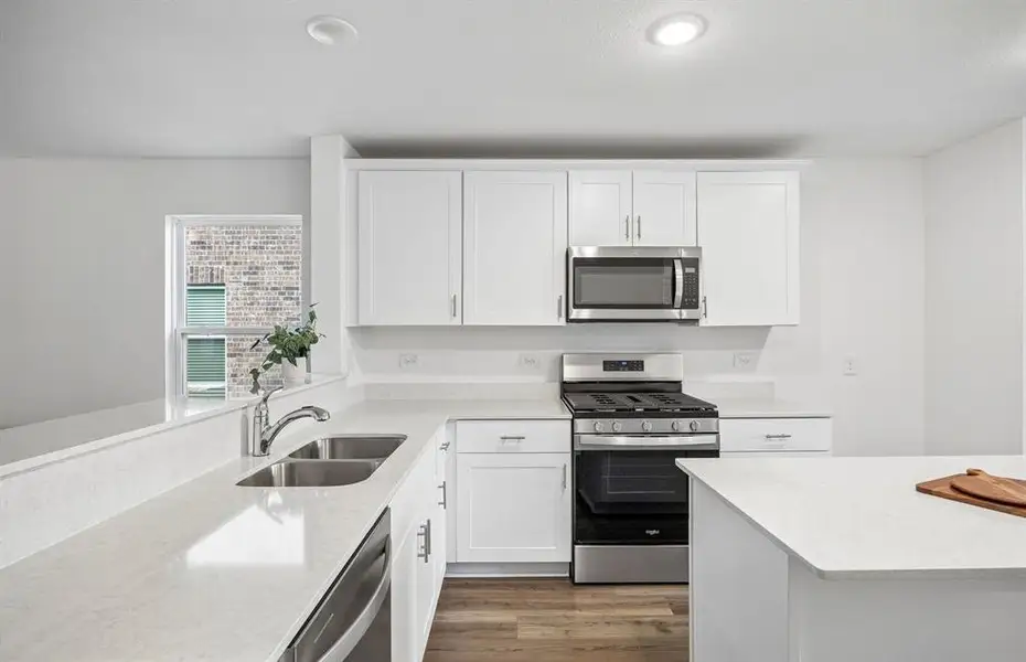 *Model Representation - Large island overlooking gathering room and dining areas