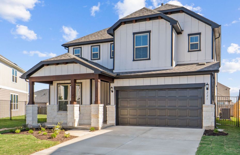 Front exterior of a new home in Santa Rita Ranch, Liberty Hill, TX, highlighting curb appeal (Image 22). Front exterior of a new home in Santa Rita Ranch, Liberty Hill, TX, highlighting curb appeal (Image 22).