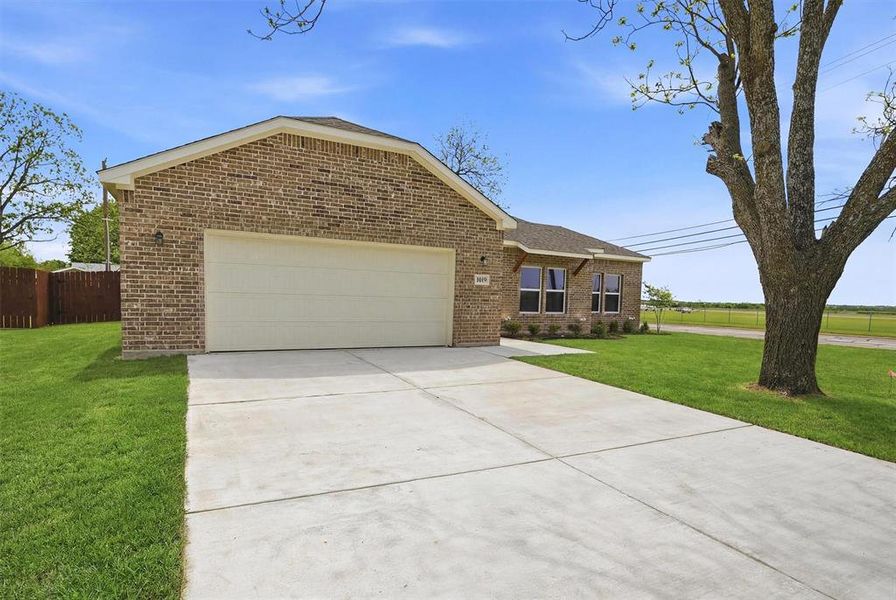 Front exterior of a new home in , Sherman, TX, highlighting curb appeal (Image 18). Front exterior of a new home in , Sherman, TX, highlighting curb appeal (Image 18).