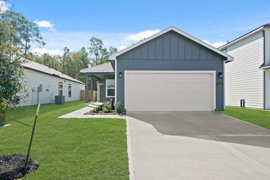 Front exterior of a new home in Maple Heights, Porter, TX, highlighting curb appeal (Image 2). Front exterior of a new home in Maple Heights, Porter, TX, highlighting curb appeal (Image 2).