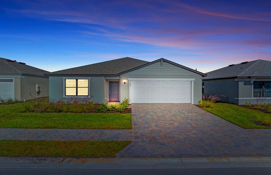 Front exterior of a new home in Caloosa Cove, Labelle, FL, highlighting curb appeal (Image 2).