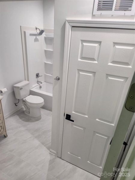 Upright Washer and Dryer Access in Full Bathroom