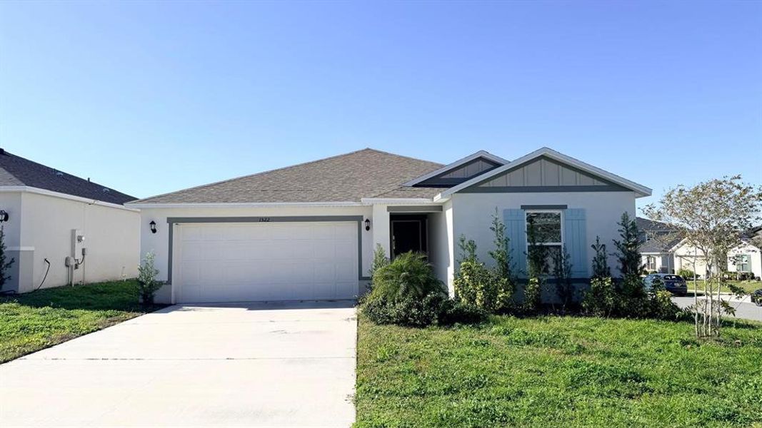 Front exterior of a new home in Lake Lucerne, Winter Haven, FL, highlighting curb appeal (Image 21).