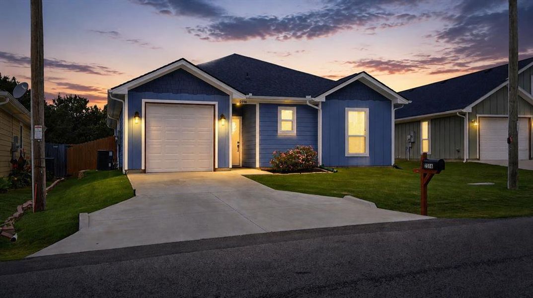 Front exterior of a new home in , Granbury, TX, highlighting curb appeal (Image 1). Front exterior of a new home in , Granbury, TX, highlighting curb appeal (Image 1).